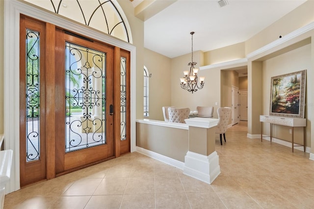 20200 Lace Cascade Rd, Land O Lakes, FL 34637 - foyer entrance with light tile patterned floors, a chandelier, and baseboards