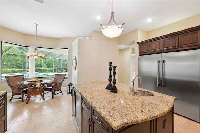 20200 Lace Cascade Rd, Land O Lakes, FL 34637 - kitchen with a sink, built in refrigerator, decorative light fixtures, light stone countertops, and recessed lighting