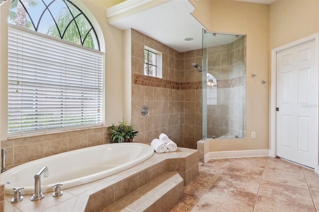 20200 Lace Cascade Rd, Land O Lakes, FL 34637 - bathroom with a garden tub, healthy amount of natural light, a tile shower, and tile patterned flooring