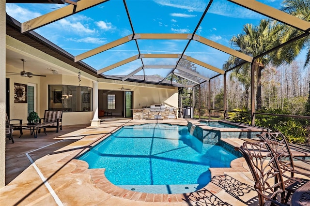 20200 Lace Cascade Rd, Land O Lakes, FL 34637 - view of pool featuring an outdoor kitchen, a ceiling fan, a patio area, and a pool with connected hot tub