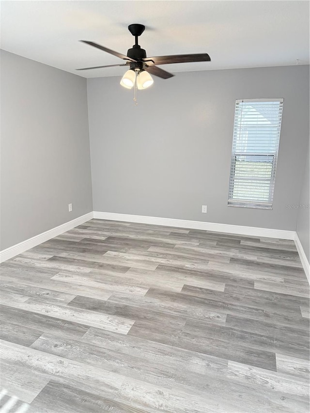 4218 San Rafael Ave, New Port Richey, FL 34655 - unfurnished room featuring wood finished floors, baseboards, and ceiling fan