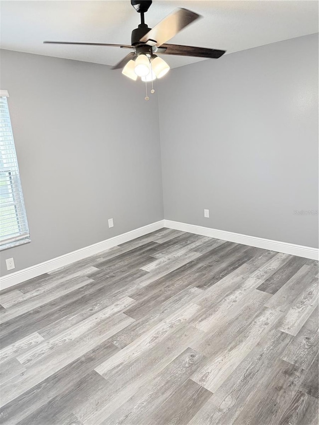 4218 San Rafael Ave, New Port Richey, FL 34655 - unfurnished room featuring a ceiling fan, baseboards, and wood finished floors