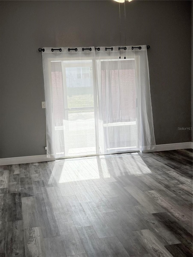 4218 San Rafael Ave, New Port Richey, FL 34655 - unfurnished room with baseboards and wood finished floors