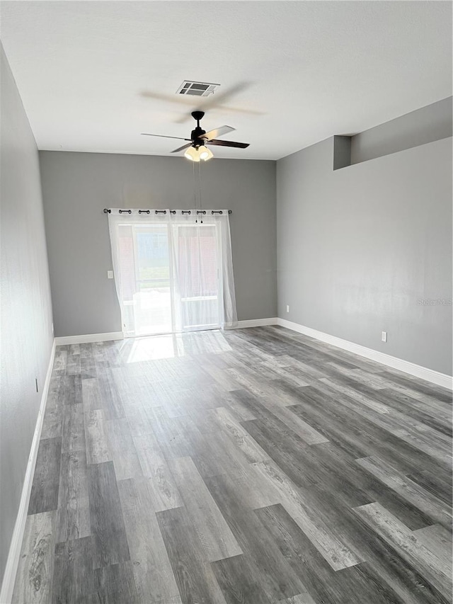 4218 San Rafael Ave, New Port Richey, FL 34655 - empty room with baseboards, visible vents, wood finished floors, and ceiling fan
