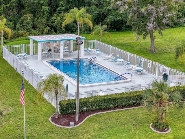 4218 San Rafael Ave, New Port Richey, FL 34655 - community pool featuring a lawn, fence, and a patio area