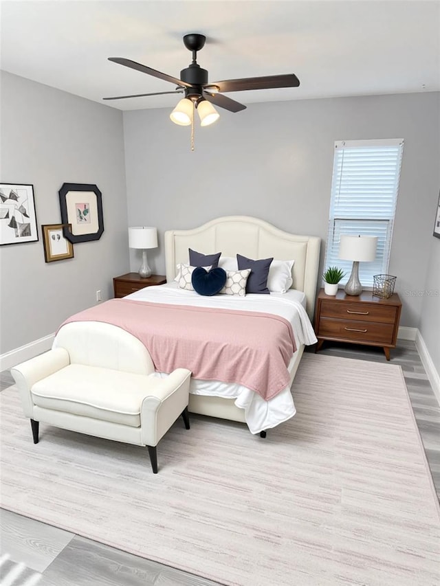 4218 San Rafael Ave, New Port Richey, FL 34655 - bedroom with baseboards, wood finished floors, and ceiling fan