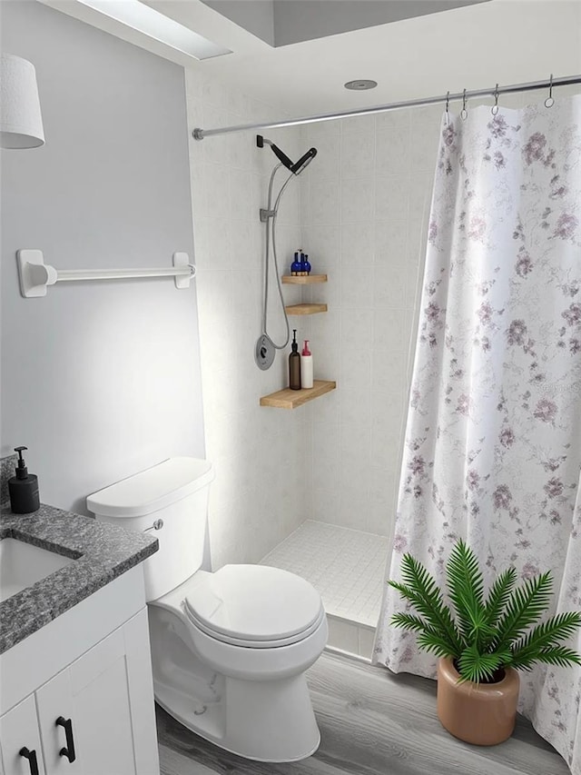 4218 San Rafael Ave, New Port Richey, FL 34655 - bathroom featuring vanity, wood finished floors, toilet, and tiled shower