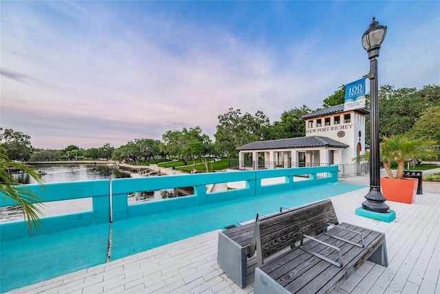 pool at dusk with a water view