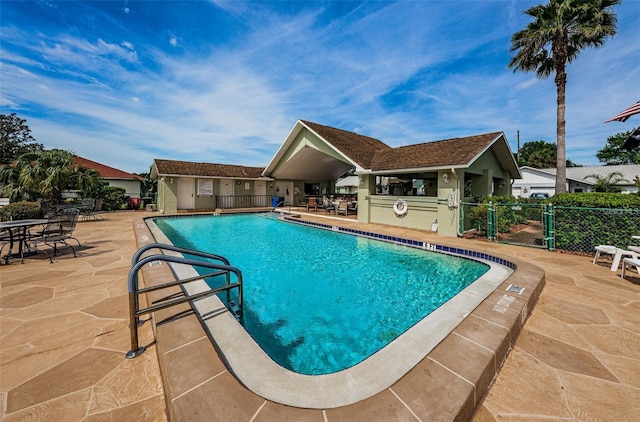 view of swimming pool with a patio area