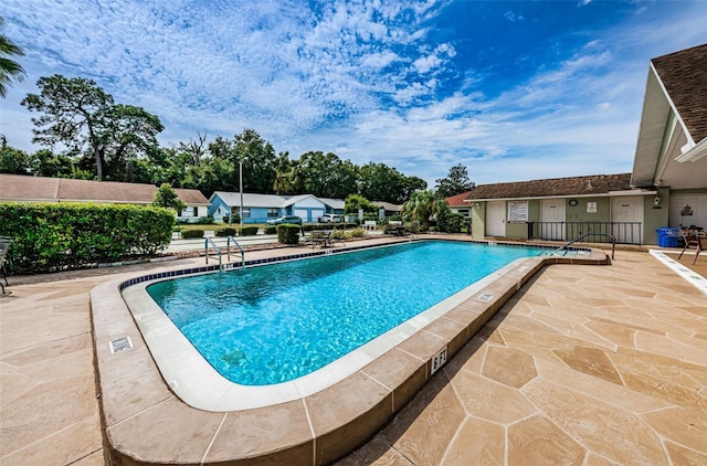 view of swimming pool featuring a patio