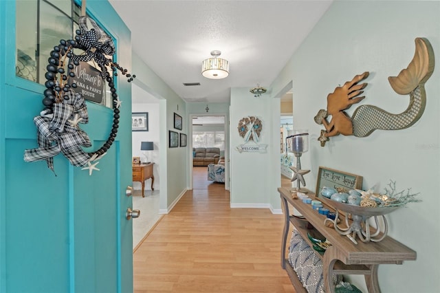 hallway featuring light hardwood / wood-style floors