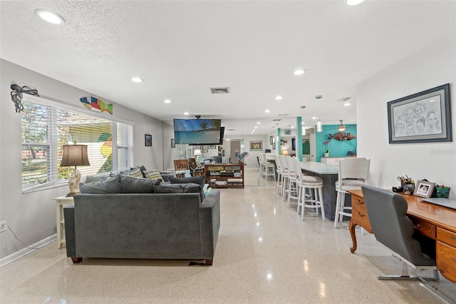 living room featuring a textured ceiling