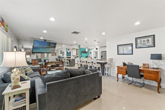 living room featuring a textured ceiling