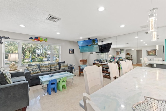 dining area featuring a textured ceiling