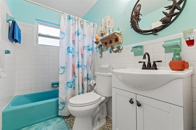 full bathroom featuring toilet, shower / tub combo, tile walls, vanity, and tile patterned flooring