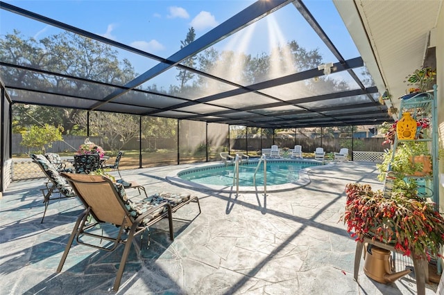 view of swimming pool with a patio and glass enclosure