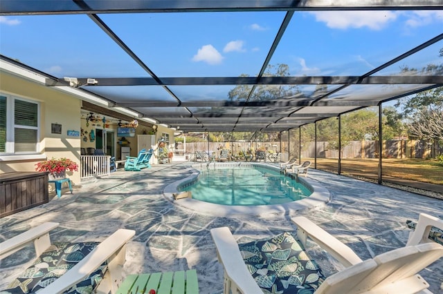 view of pool featuring a patio and glass enclosure