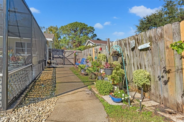 view of yard featuring a lanai