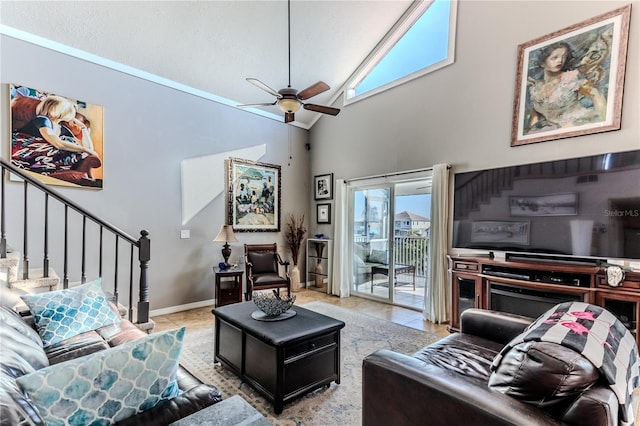 tiled living room with high vaulted ceiling and ceiling fan