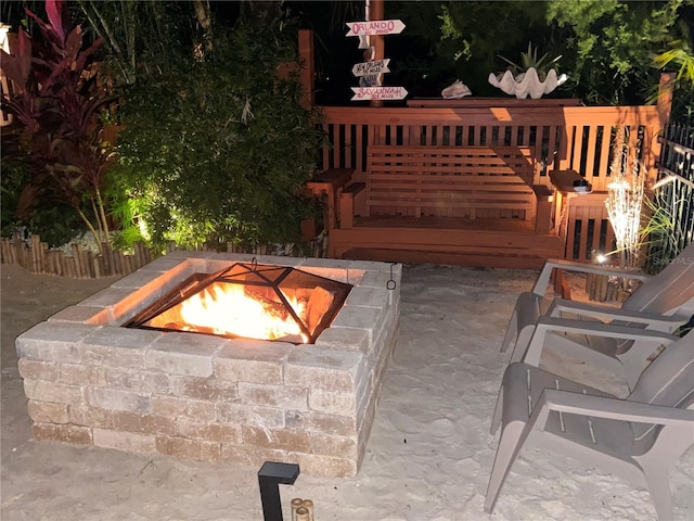 view of swimming pool featuring an outdoor fire pit