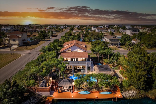 aerial view at dusk with a residential view