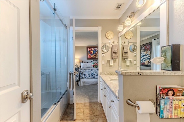 bathroom featuring vanity, crown molding, and shower / bath combination with glass door