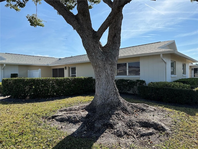 view of home's exterior with a yard