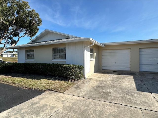 view of property exterior featuring a garage