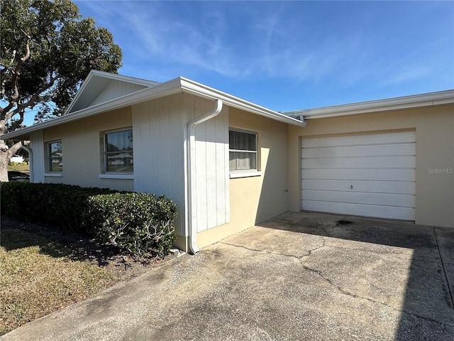 view of side of property featuring a garage