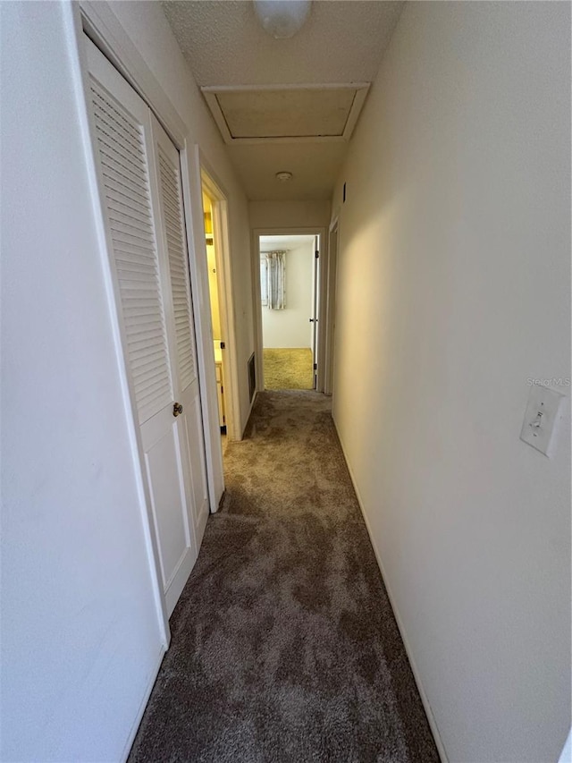 corridor with dark carpet