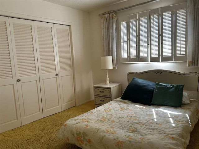 carpeted bedroom featuring a closet