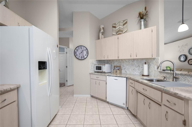 kitchen with sink, light tile patterned floors, pendant lighting, white appliances, and backsplash