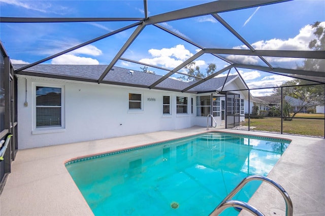 view of pool with a patio and a lanai