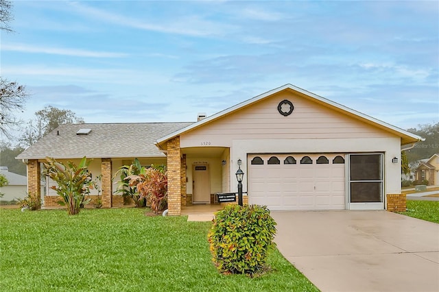 ranch-style house with a garage and a front yard