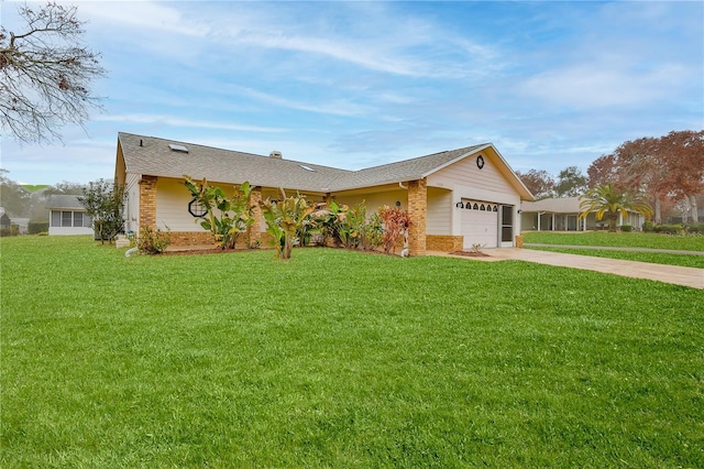 ranch-style house featuring a garage and a front lawn