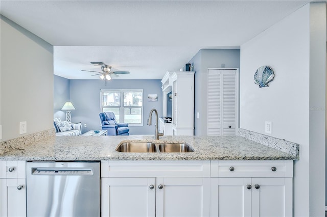 kitchen featuring white cabinetry, dishwasher, and sink