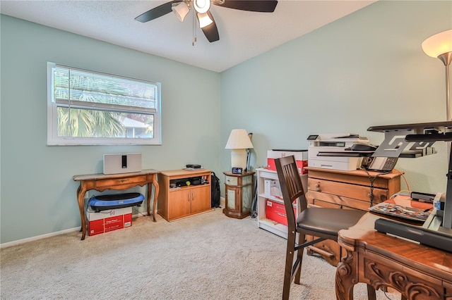 home office with light carpet and ceiling fan