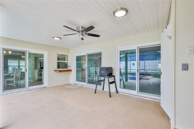 view of patio / terrace with ceiling fan and a grill