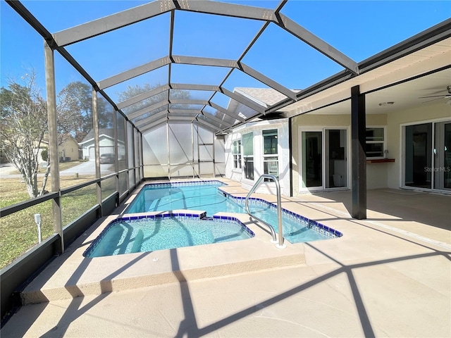 view of swimming pool with a patio and glass enclosure