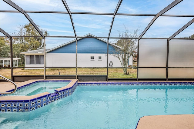 view of pool featuring a lanai and an in ground hot tub