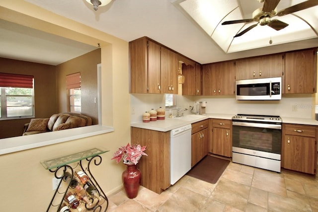 kitchen featuring ceiling fan, appliances with stainless steel finishes, and sink