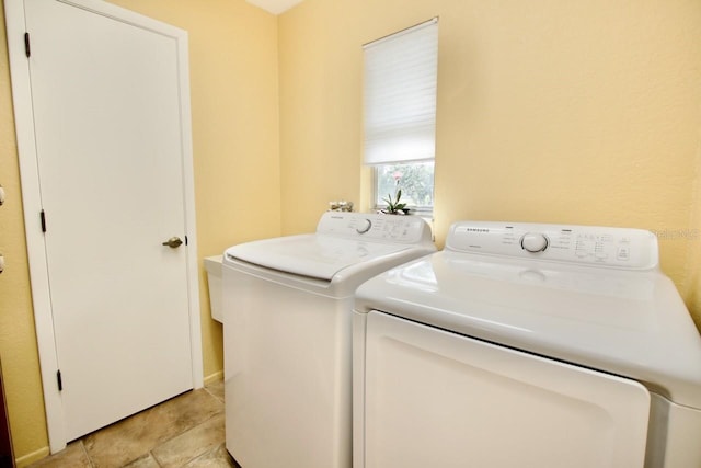 clothes washing area with washing machine and clothes dryer