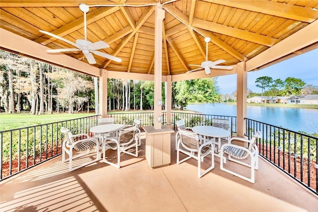 view of patio / terrace featuring a gazebo, a water view, and ceiling fan