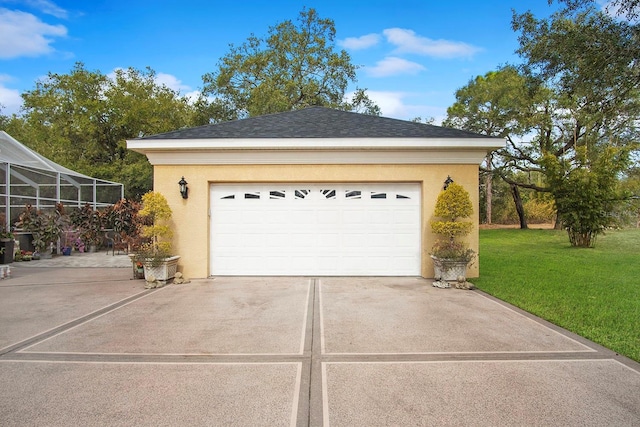 garage with a lawn