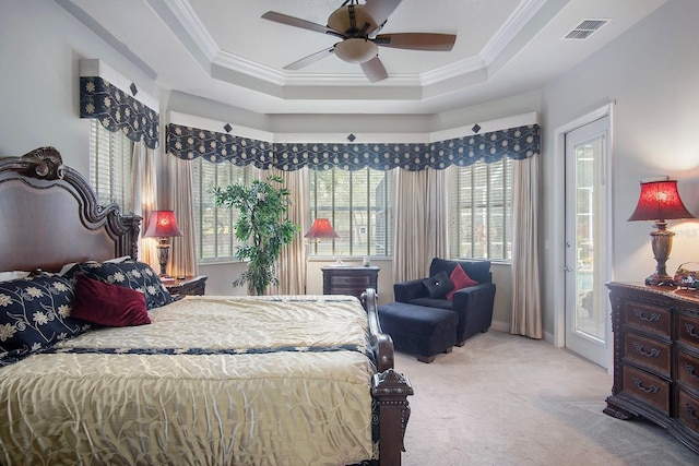 bedroom with crown molding, light colored carpet, access to exterior, and a raised ceiling