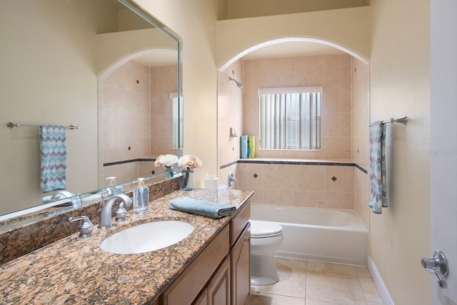 bathroom featuring vanity, toilet, and tile patterned flooring