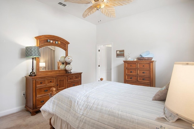 bedroom featuring ceiling fan and light carpet