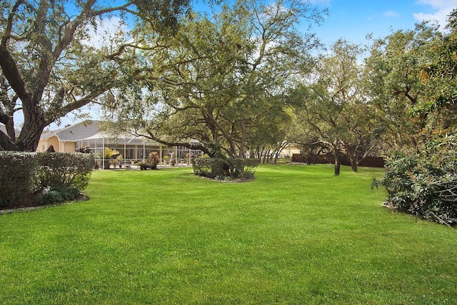 view of yard featuring a lanai