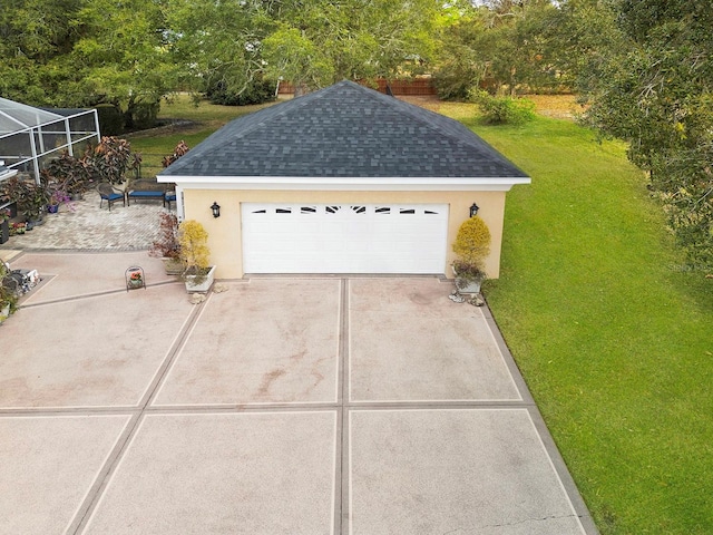 garage featuring a yard