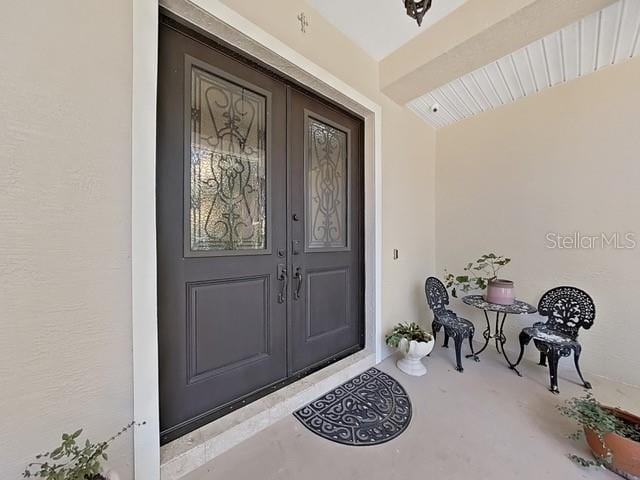 entrance to property featuring french doors